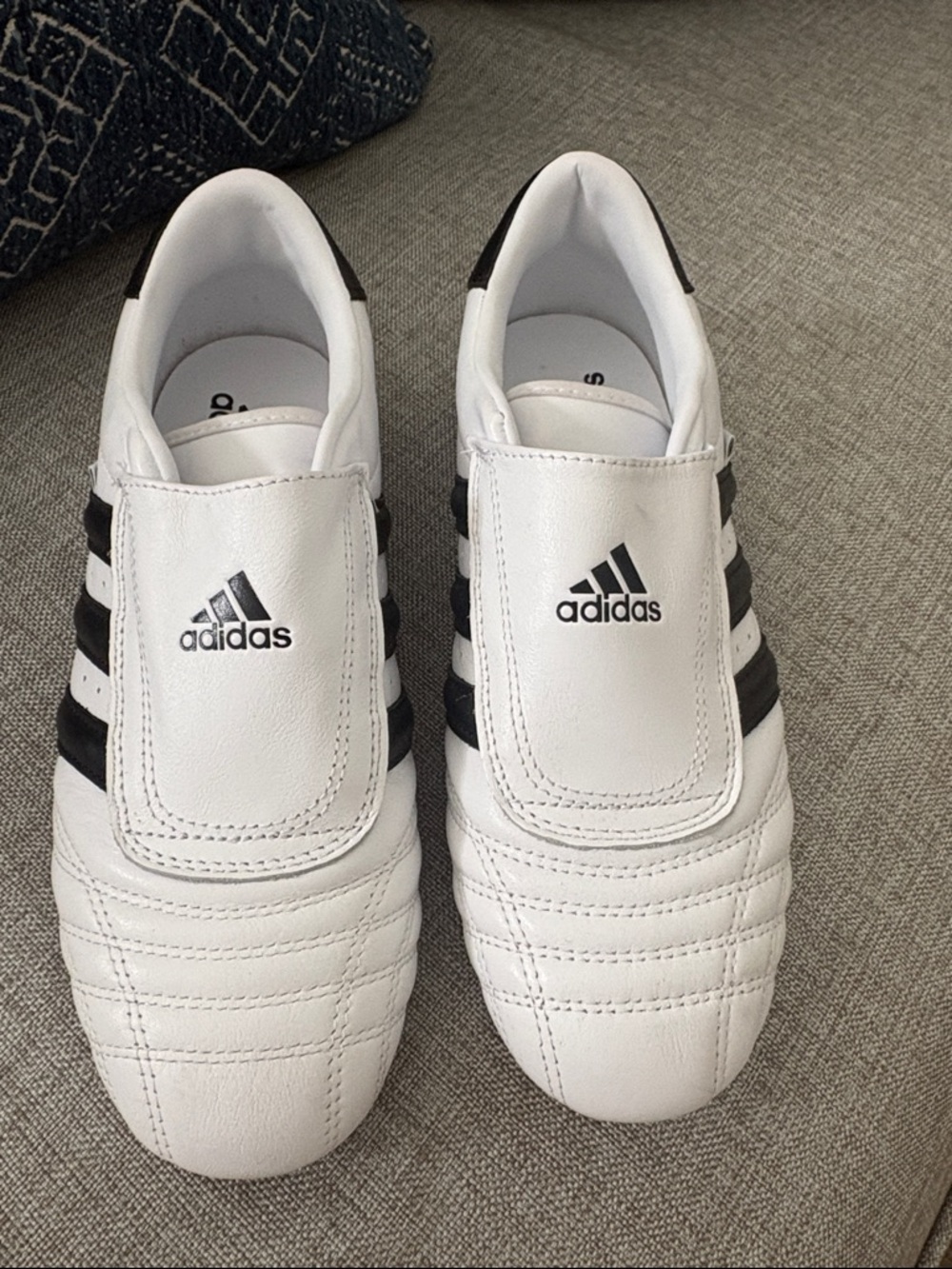 adidas White Sneakers with Black Three-Stripes

Women’s size 7.